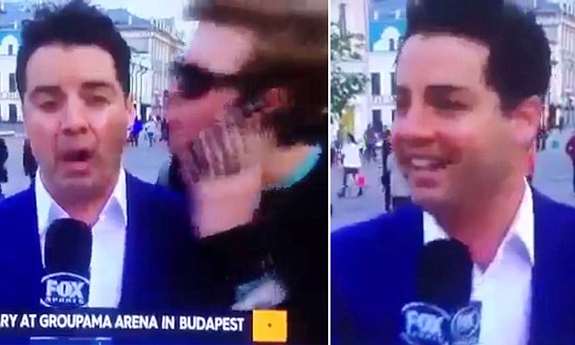 Fan cuồng cưỡng hôn phóng viên World Cup - Bóng Đá