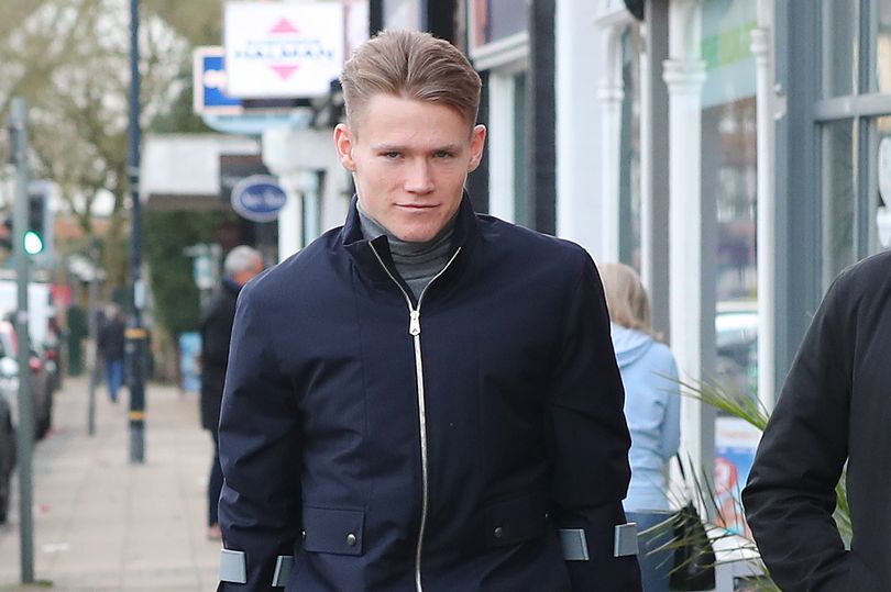 Manchester United midfielder Scott McTominay pictured on crutches after injury - Bóng Đá