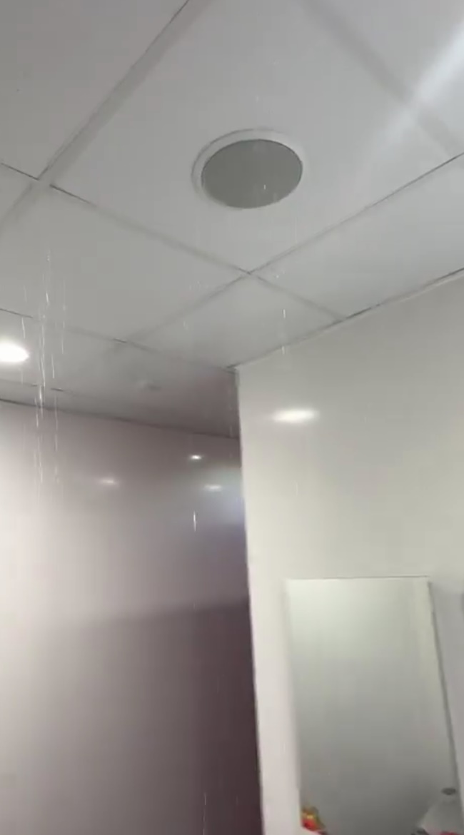 Workers scale Old Trafford to look at leaky roof after Man Utd stands were soaked by WATERFALL - Bóng Đá