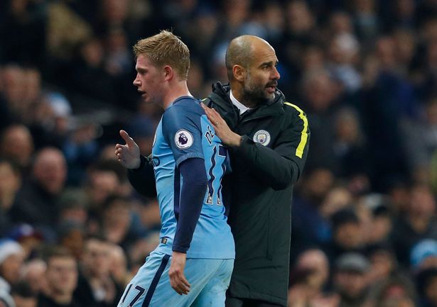 Manchester-Citys-Kevin-De-Bruyne-with-manager-Pep-Guardiola-as-he-is-substituted