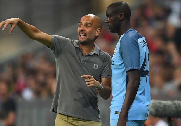 pep-guardiola-and-yaya-toure-of-manchester-city_598mju7ocqzq1ahl0ajr91j0s