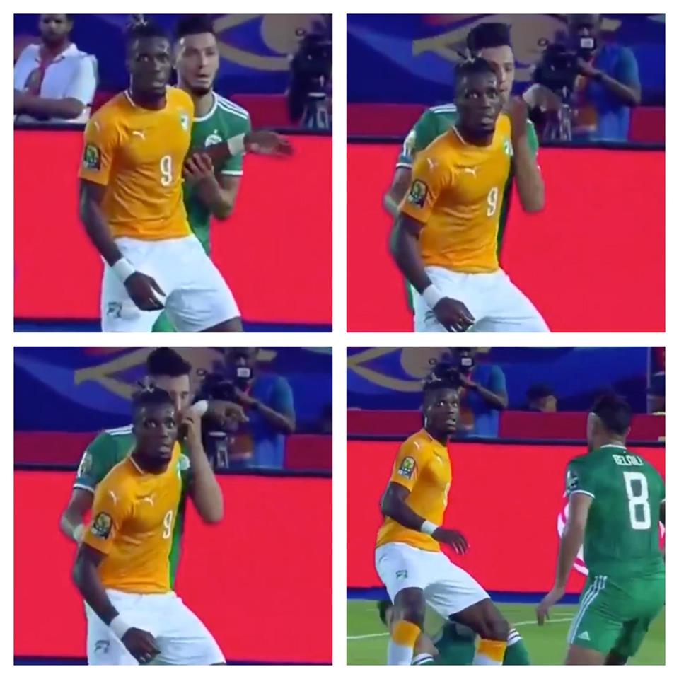 Algeria defender Ramy Bensebaini smacked himself in the face with Wilfried Zaha’s hand - Bóng Đá