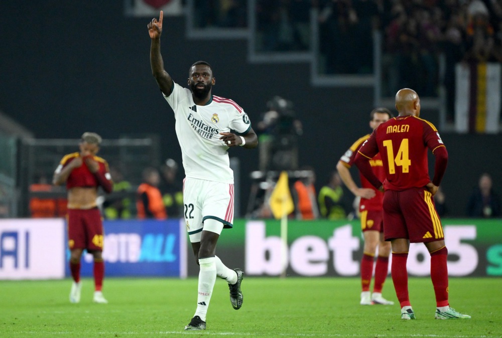 Rudiger ấn định chiến thắng 4-3 cho Real. Ảnh: EPA.